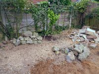 The new rockery in place. The other stones.will be used for the patio.
