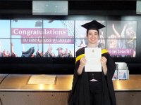 Kit with her degree certificate in the foyer of the Wales Millennium Centre.